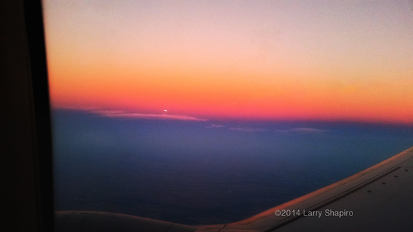 dramatic sunset through an airplane window