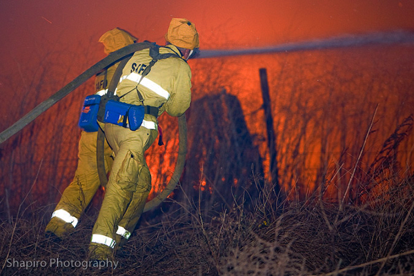 firemen fighting a wild land fire in California