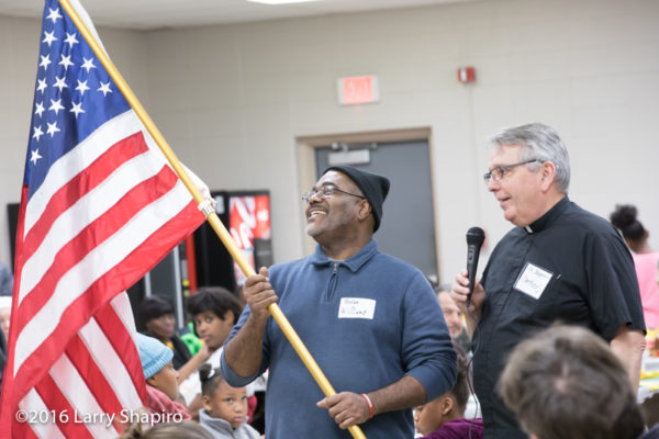 veteran hold flag at Thanksgiving dinner