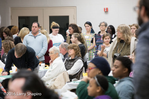 volunteers and guests at a community Thanksgiving dinner