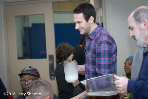 volunteer serves Thanksgiving dinner