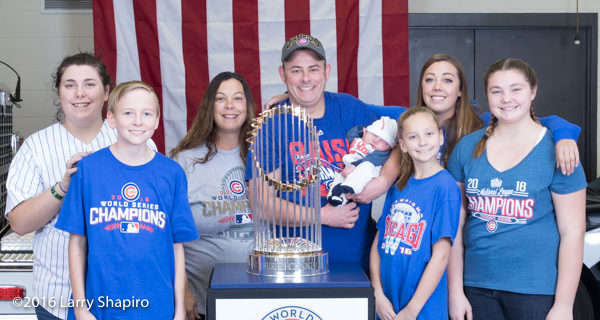 family with the world series championship trophy