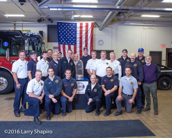 Winnetka Fire Department personnel with the world series trophy