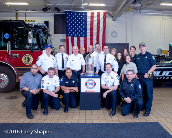 Winnetka Police Department personnel with the world series trophy