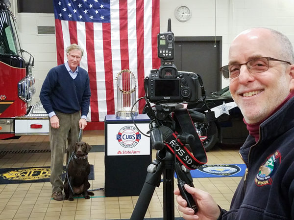 Larry Shapiro taking photos of the World Series championship trophy