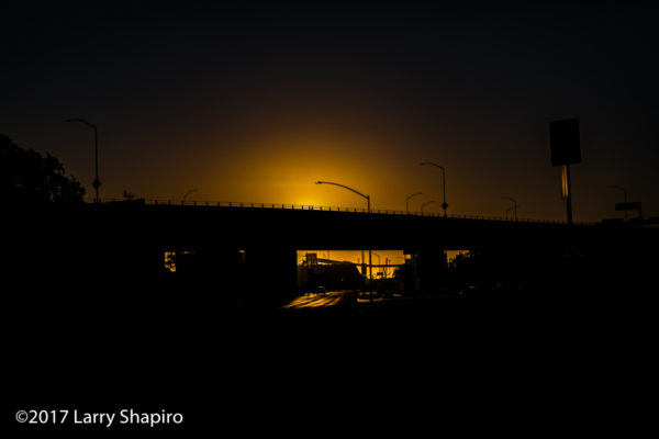 sunset at the end of the road