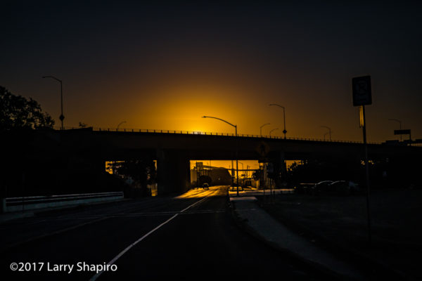 sunset at the end of the road