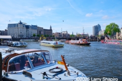 Multiple tour boats in Amsterdam, April 2025.