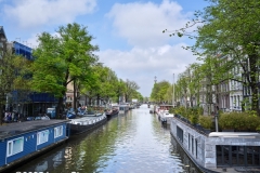 House boats lining a canal in Amsterdam, April 2025.