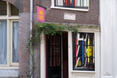 Amsterdam shop with crooked door and brickwork
