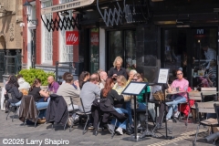 People eating at an outdoor cafe in Amsterdam